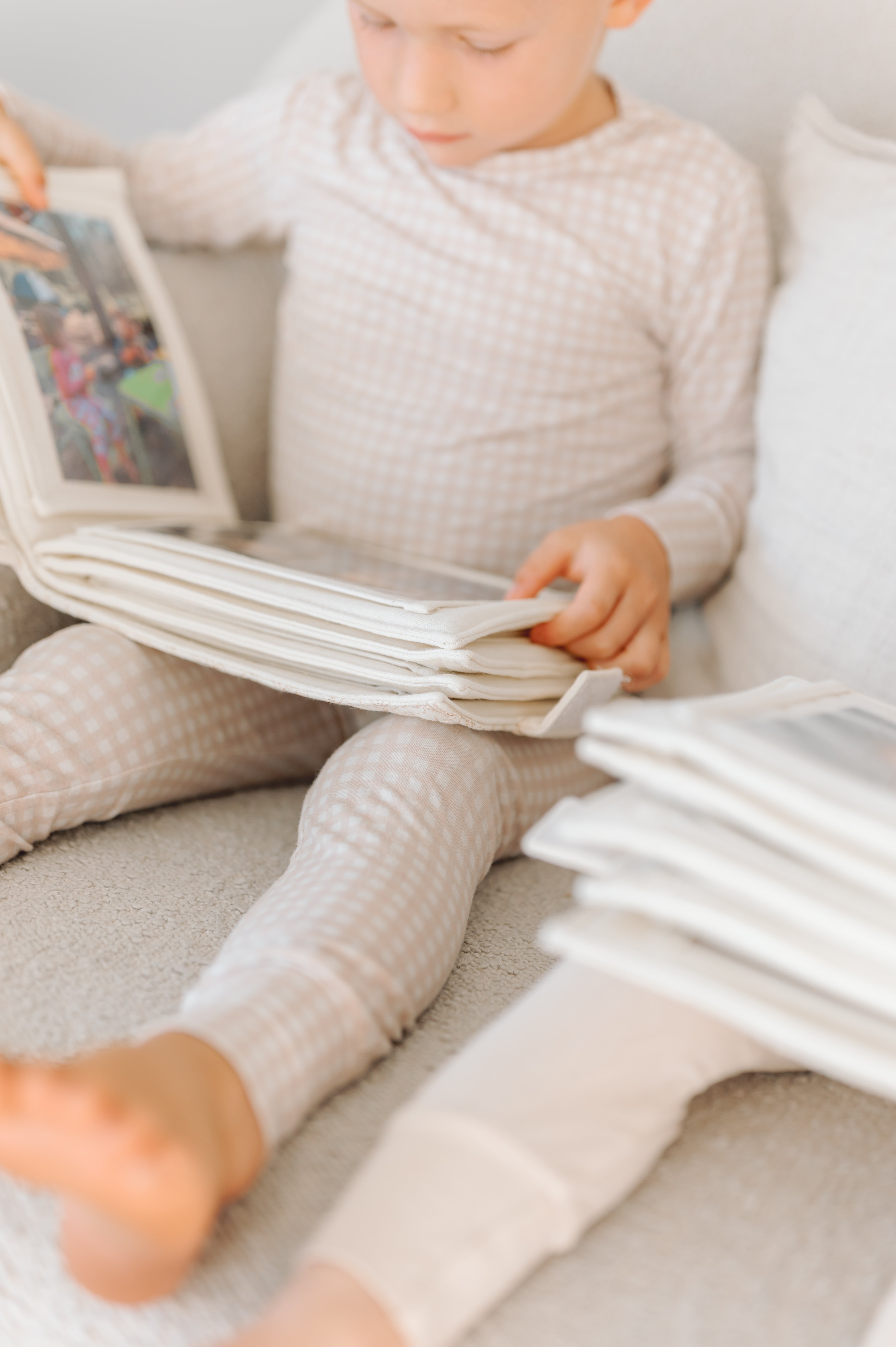 boy looking through a photo album