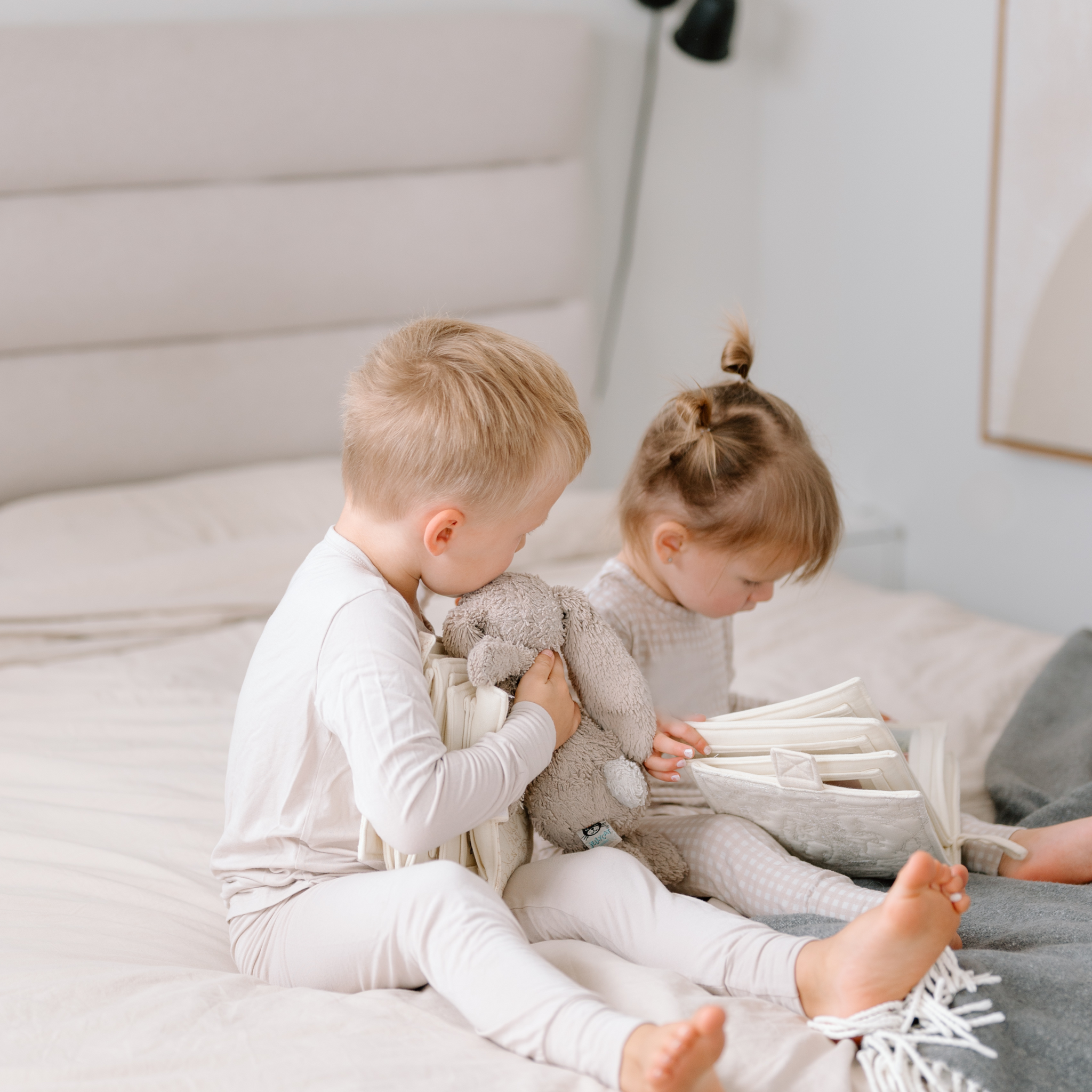 toddlers looking at a photo book